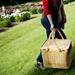 A family carries a picnic basket near the Peony Garden on Tuesday, June 4. Daniel Brenner I AnnArbor.com
